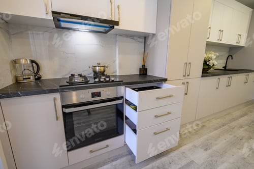 Preview: Luxury beige and cream kitchen interior details, some drawers retracted
