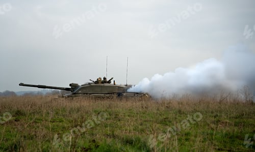 Preview: Military tanks moving in a field