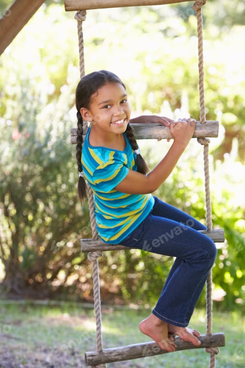 Preview: Young Girl Climbing Rope Ladder To Treehouse
