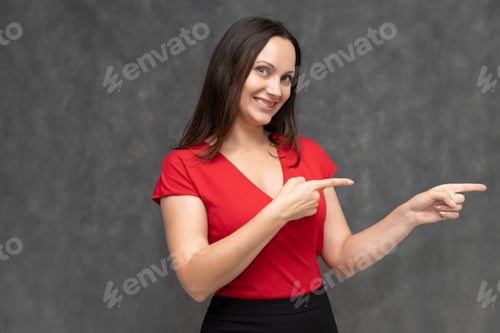 Preview: Portrait To The Waist Of A Young Pretty Brunette Woman Of 30 Years Old In A Bright Red Sweater With