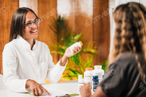 Preview: Functional Medicine Female Practitioner Recommending Dietary Supplement to a Client