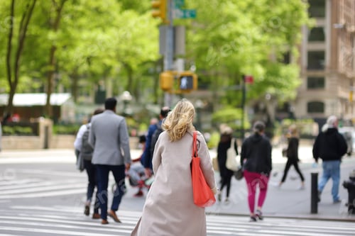 Preview: NEW YORK , USA - MAY 11 2021: people cross the road near Bryant Park in NYC, America.