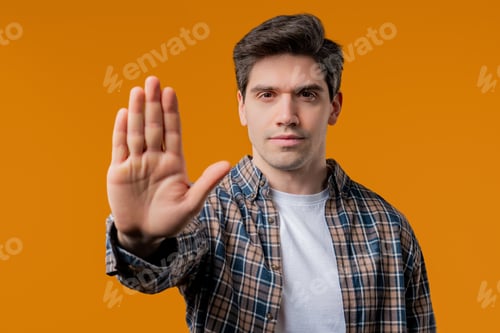Preview: Serious Man Showing Rejecting Gesture By Stop Palm Sign. Not Allow, Prohibition