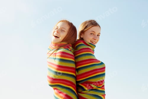 Preview: Girls with blanket wrapped around themselves