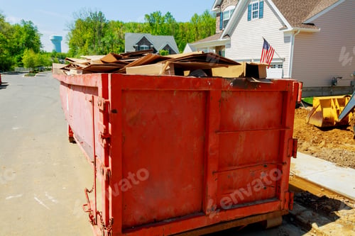 Preview: Loaded dumpster near a construction, home renovation