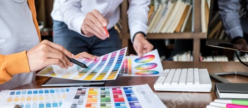 Preview: Two colleagues creative graphic designer working on color selection and drawing on graphics tablet