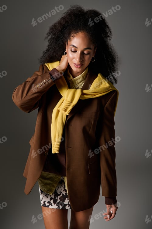 Preview: Autumn styles with a stunning Black woman in a chic studio setting