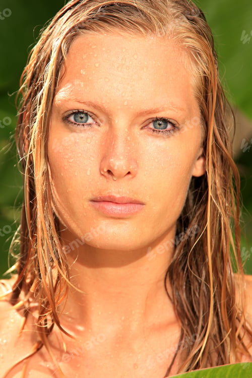 Preview: woman in tropical shower palms around