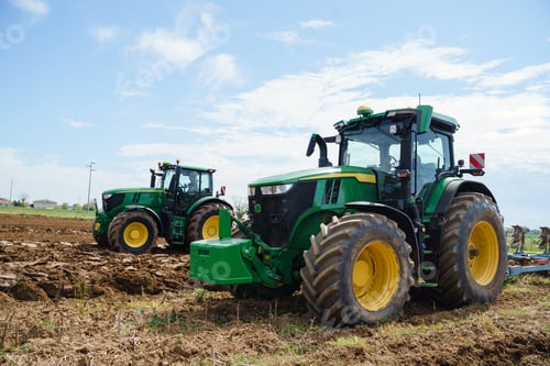 Preview: Tractors Working on Field in Rural Environment
