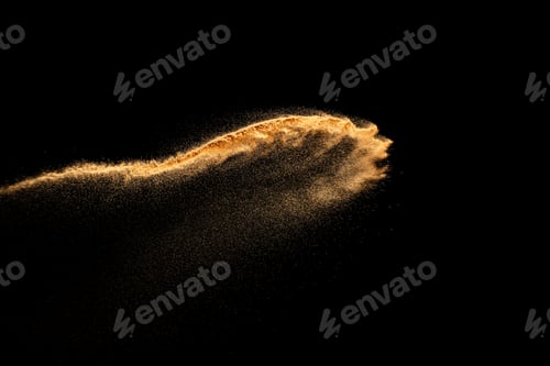 Preview: Sand explosion isolated on black background. Freeze motion of sandy dust splash.