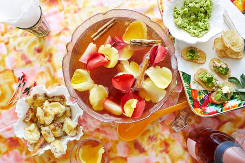 Preview: Vibrant table setting with a variety of foods and drinks.