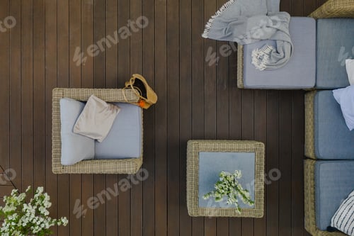 Preview: Top view of wooden terrace with comfortable wicker garden furniture