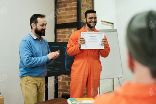 Preview: Young Adult Man Receiving Certificate during Prison Education Program