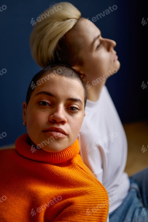 Preview: Portrait with selective focus of young female lesbians LGBT couple