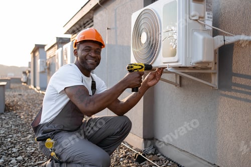Preview: Man kneeling with screwdriver near air conditioner outdoors