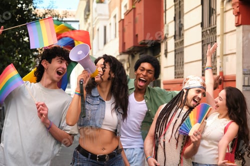Preview: Young activists marching for lgbtq plus rights and holding rainbow flags and megaphone