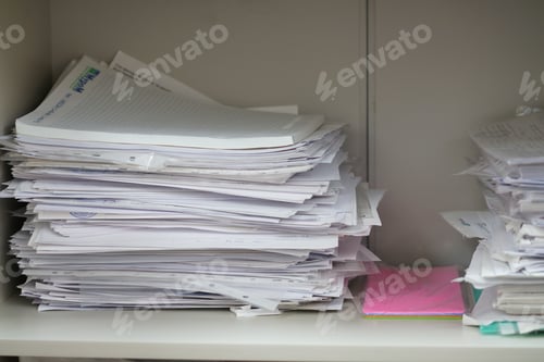 Preview: Documents and papers in a pile, documents in an office