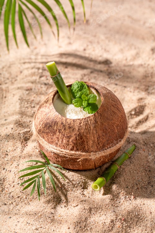 Preview: Fresh and tasty pinacolada in coconut served with straw.