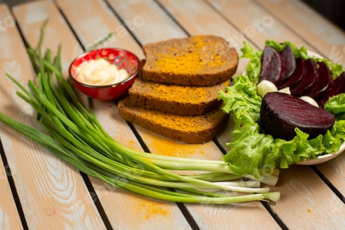 Preview: front view bread loafs with green onion and beet on the wooden desk bread green vegetable