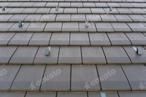 Preview: Roof with modern tiles and snow fasteners.