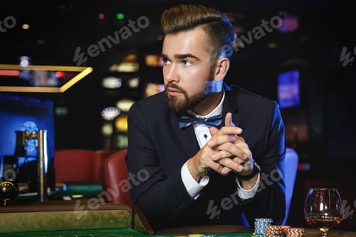 Preview: Handsome man playing roulette in the casino