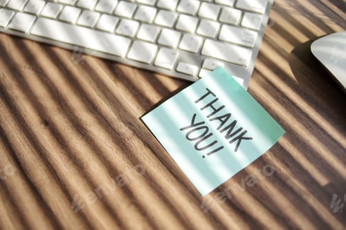 Preview: Thank You Handwriting on Blue Sticky Note at Office