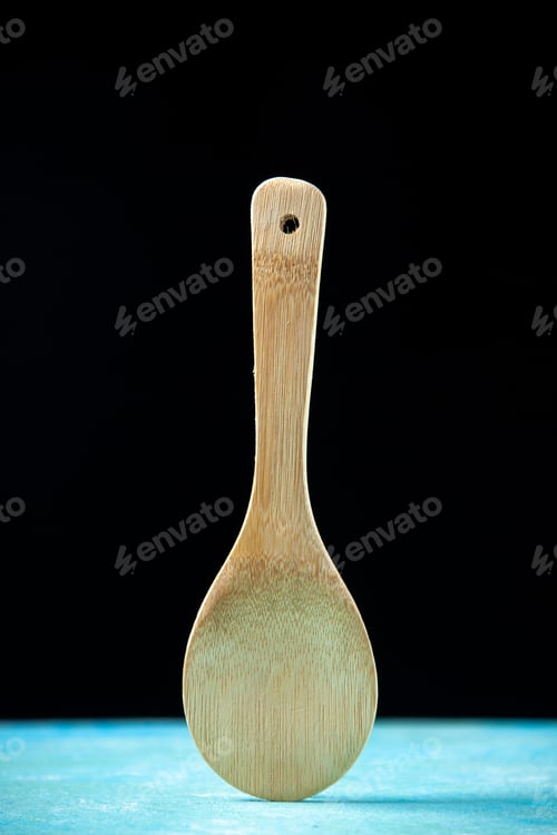 Preview: front view round wooden spoon placed upright on black background