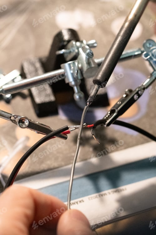 Preview: Photo of a man making connections for electric wires