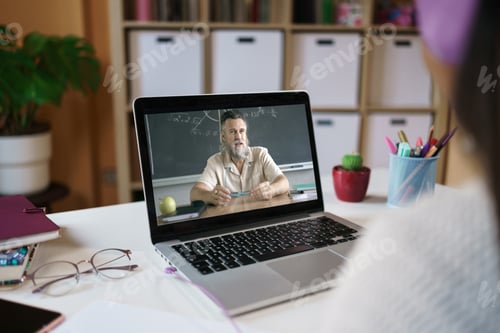 Preview: Student Attending Online Class at Home on Laptop