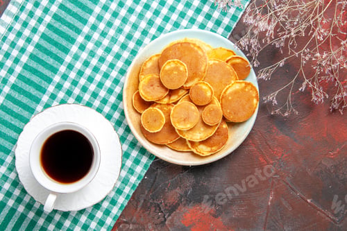 Preview: Overhead view of delicious pancakes with a cup of tea