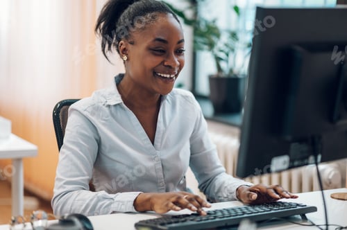 Preview: Business working on a computer in a creative office environment