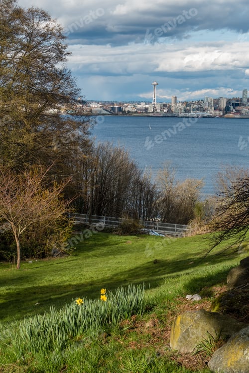 Preview: A View Of The Seattle Skyline With Billowing Clouds Overhead.