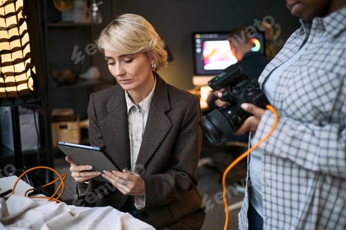 Preview: Caucasian Middle Aged Woman Using Digital Tablet during Professional Photoshoot