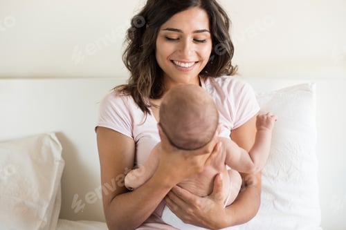 Preview: Young Woman Holding a Newborn Baby Inside