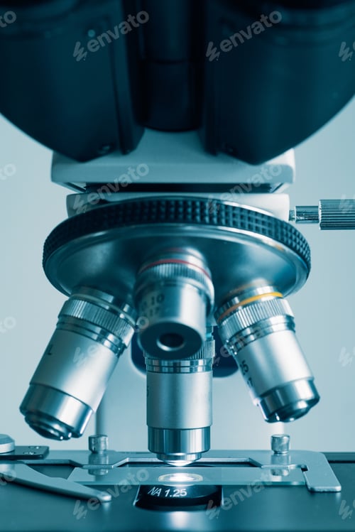 Preview: Modern microscope with metal lens at laboratory.