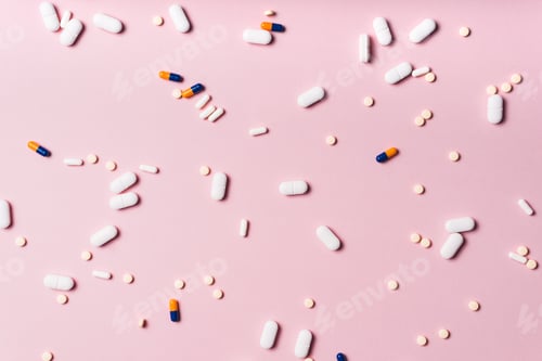 Preview: medicine tablets and capsules scattered