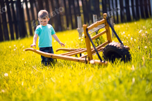 Preview: Little boy working in the fields