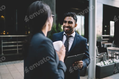 Preview: Happy colleagues communicating with each other