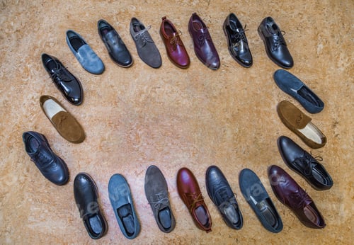 Preview: Many pairs of shoes on the beige background