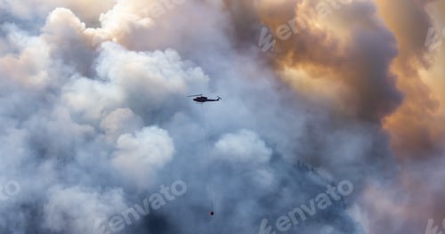 Preview: Wildfire Service Helicopter flying over BC Forest Fire and Smoke on the mountain near Hope