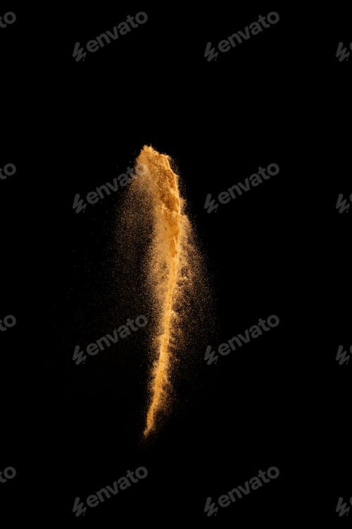 Preview: Brown color sand splash against black background. Sand fly wave in the air.