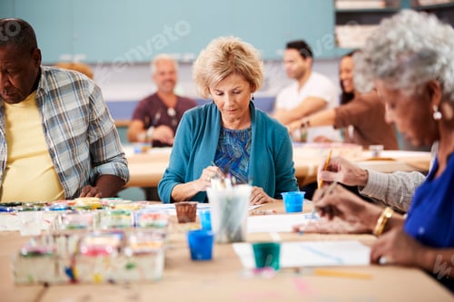 Preview: Group Of Retired Seniors Attending Art Class In Community Centre With Teacher