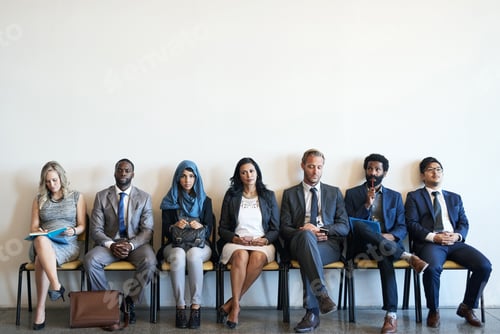 Preview: Shot of a group of well-dressed businesspeople seated in line while waiting to be interviewed