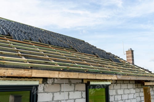 Preview: Roof ceramic tile arranged in packets on the roof on roof battens. laying tiles on a boarded roof.