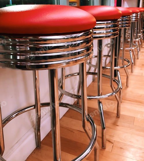 Preview: Red and chrome retro bar stools at a restaurant
