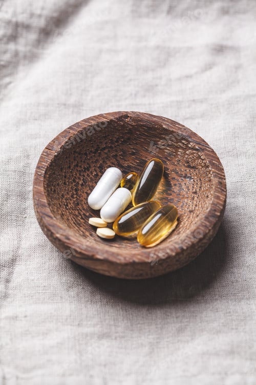 Preview: Capsules and tablets of vitamins. Health and beauty concept.
