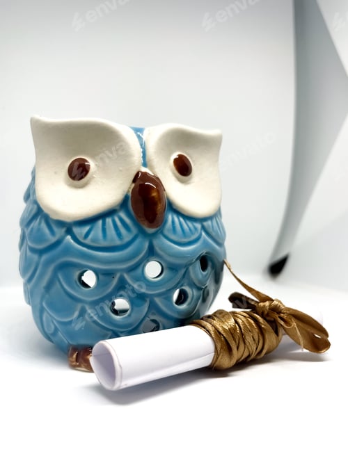 Preview: Ceramic Owl and Rolled Paper Tied with Ribbon