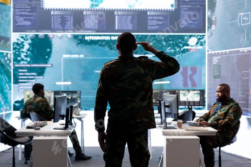 Preview: Special operations agent saluting his military crew in control center