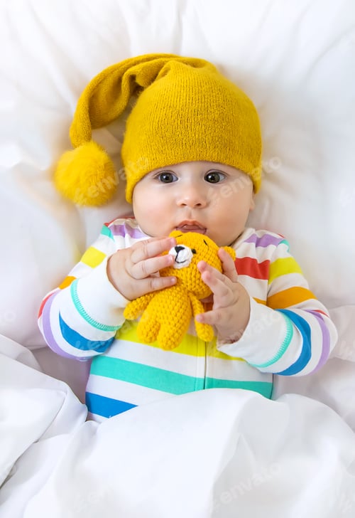 Preview: The baby in the crib goes to bed. Selective focus.