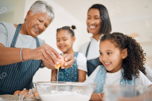Preview: The eggs make it extra fluffy. Shot of a multi-generational family baking together at home.